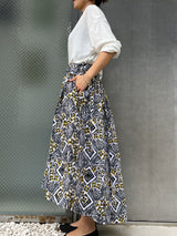 Abu Dhabi Gather Skirt -Flower blooming on concrete-